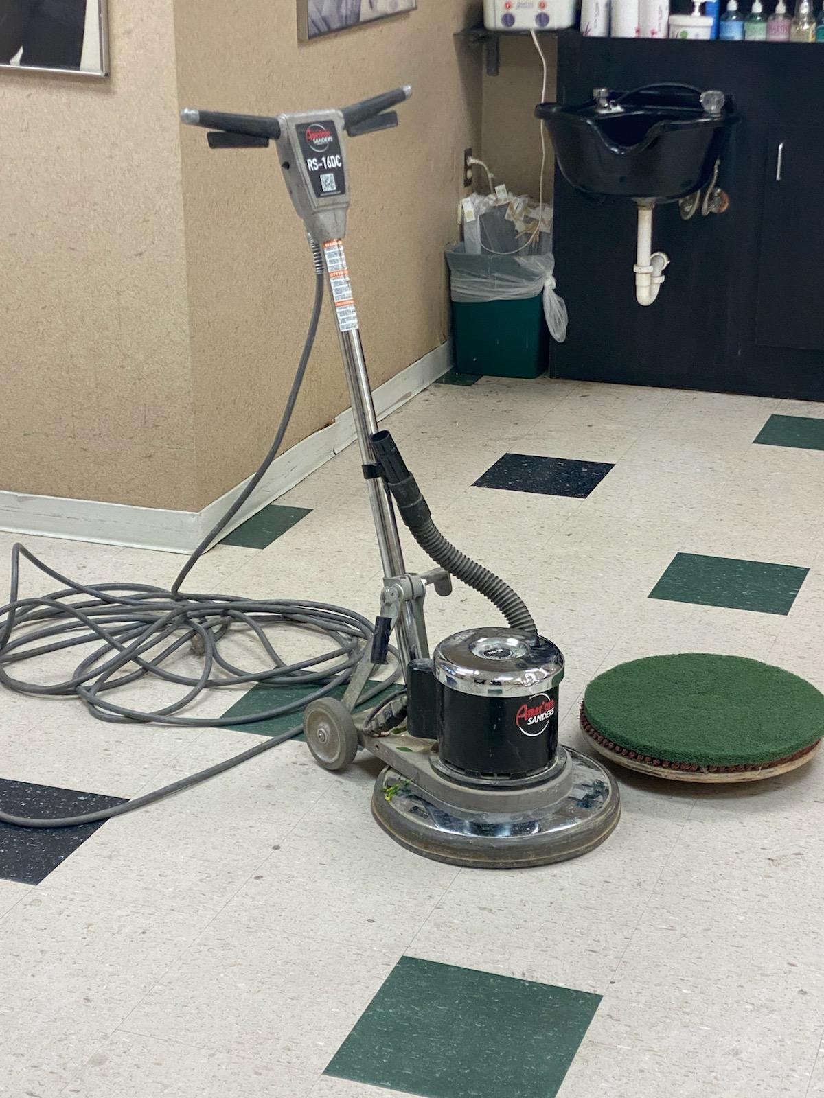 Ascent Cleaning Solutions commercial floor buffer on VCT — strip and wax service