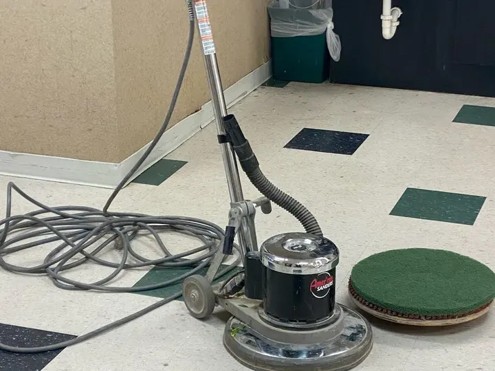 Ascent Cleaning Solutions commercial floor buffer on VCT — strip and wax service